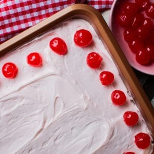 cherry cake in brass colored pan