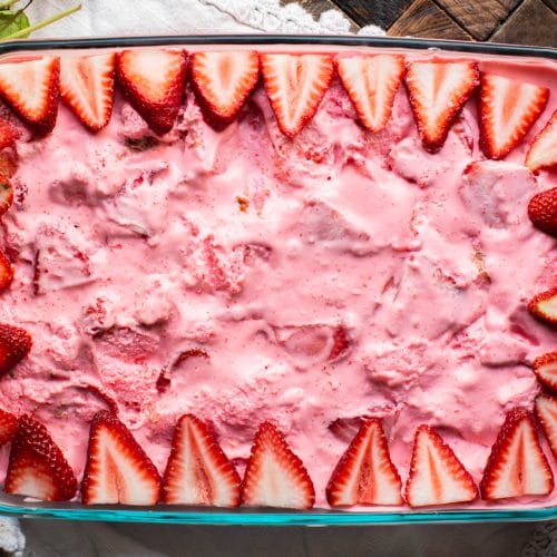 9x13 pan with strawberry jello dessert in it.