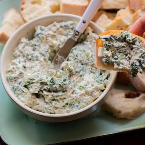 spinach dip on piece of bread.